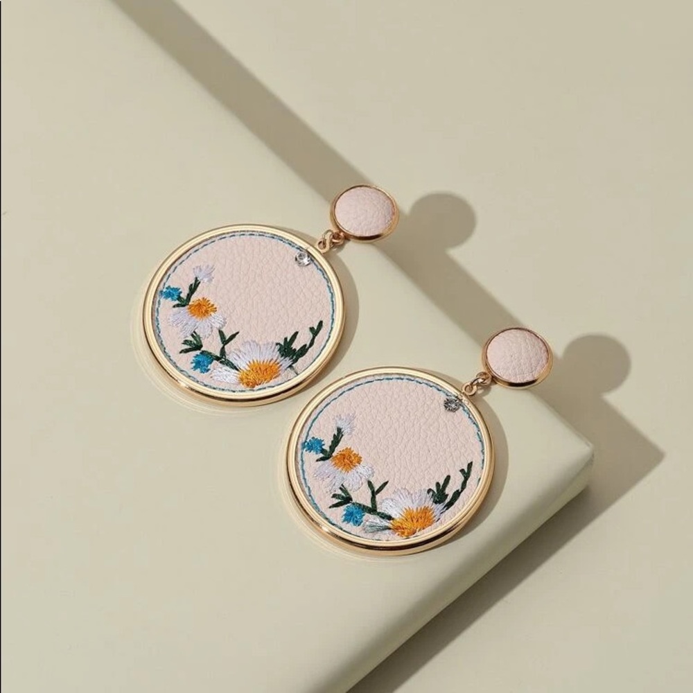 Three dangling earrings